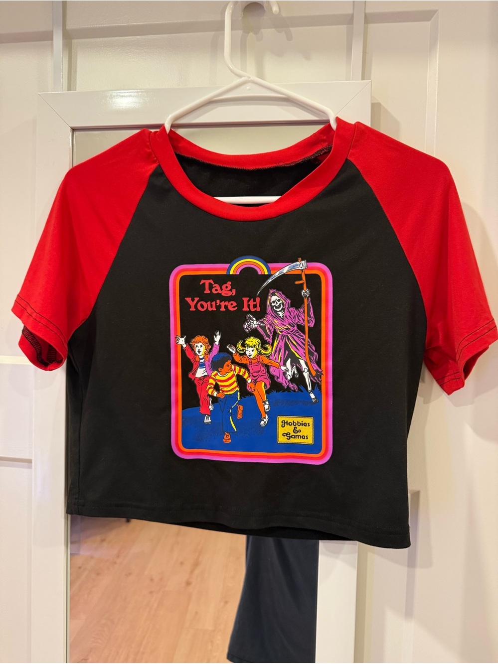 Romwe graphic crop top featuring the "Tag, You're It!" artwork by Steven Rhodes